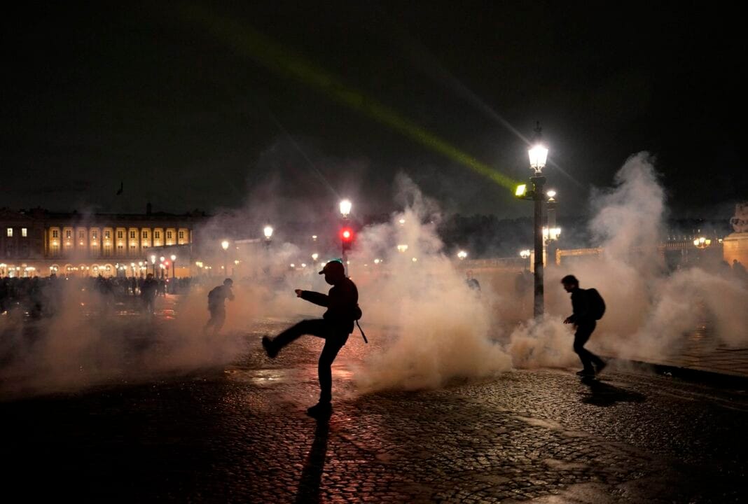 French police use tear gas to disperse protesters against pension reform bill in Paris