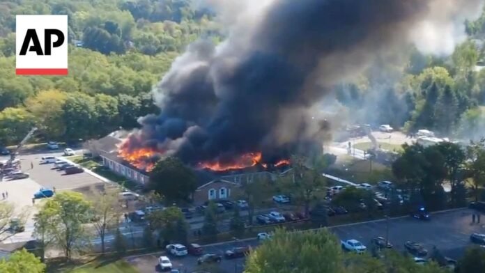 Fire engulfs Michigan church as police respond to shooting (Video)