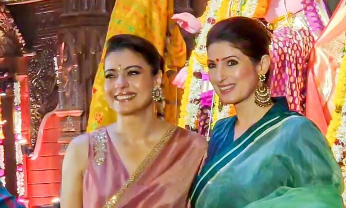 Twinkle Khanna poses with her 'Two Much With Kajol and Twinkle Khanna poses with her 'Two Much With Kajol and Twinkle’ co-host during Durga Puja