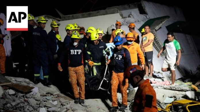 Philippines earthquake: AP photographer describes the scene as workers retrieve bodies (Video)