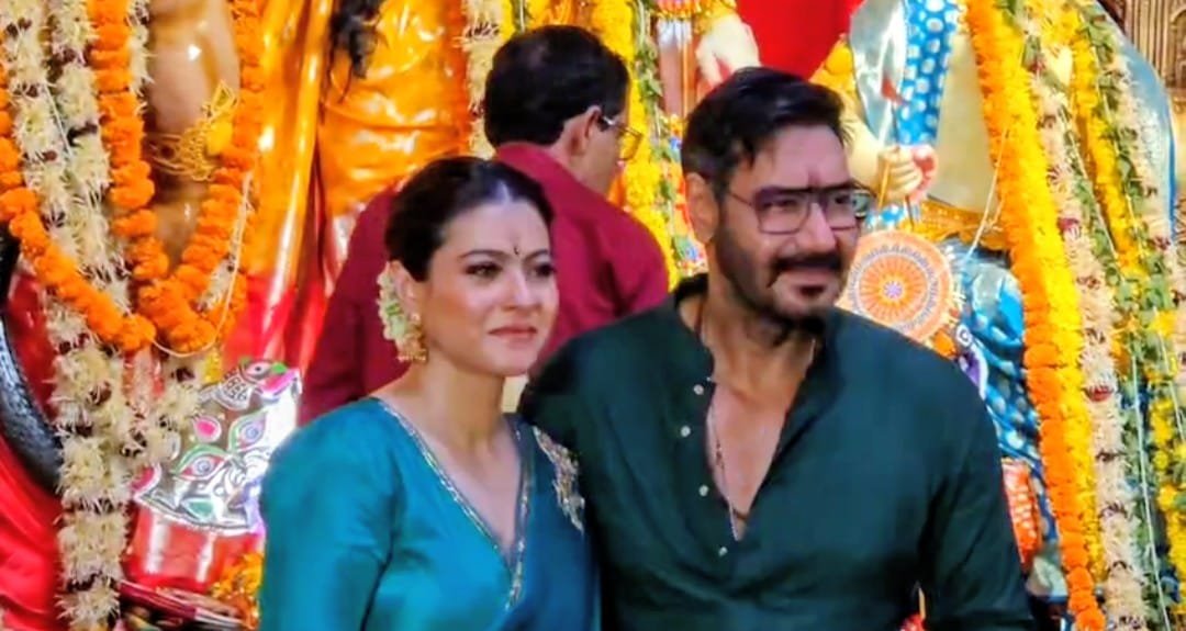 Ajay Devgn & Kajol twin in green during the Maha Navmi celebration