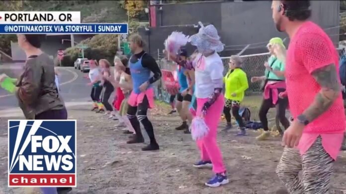 ‘ABSURD’: Host break down in LAUGHTER at activists doing aerobics amid ICE riots (Video)