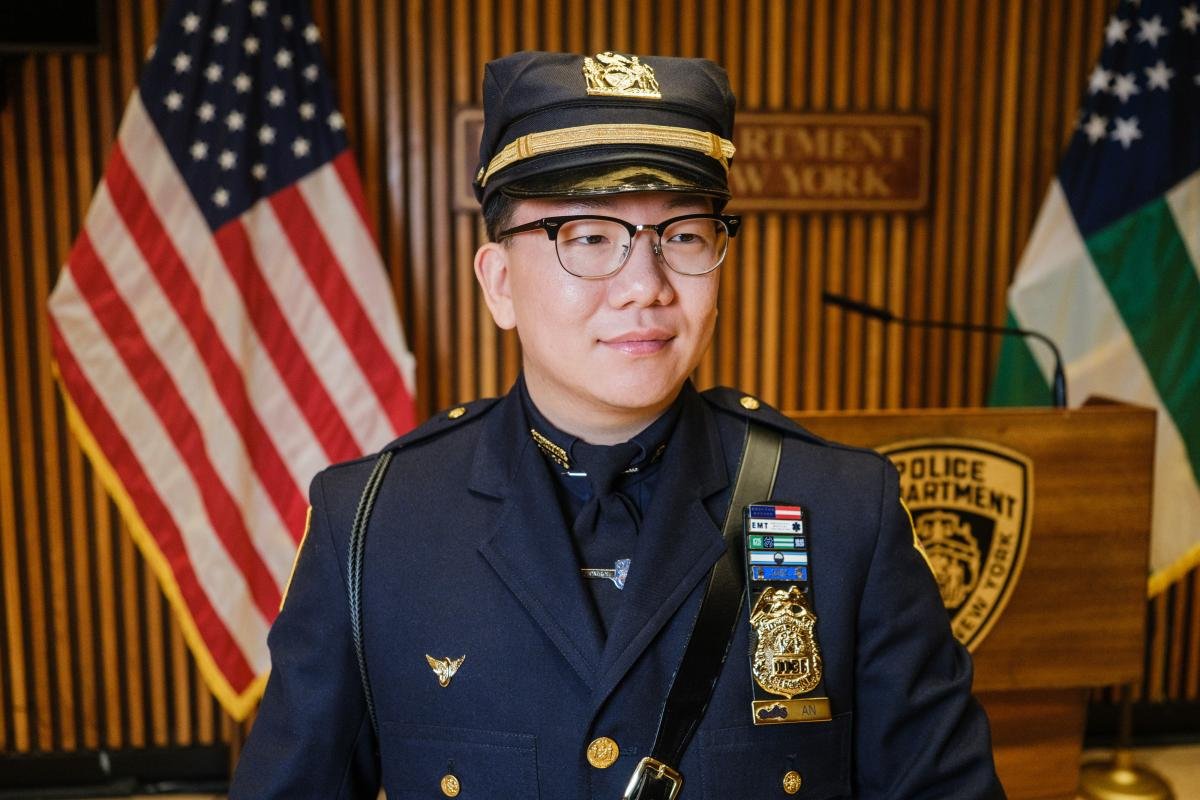 NYPD cop gets touching unexpected surprise from two special fans at promotion