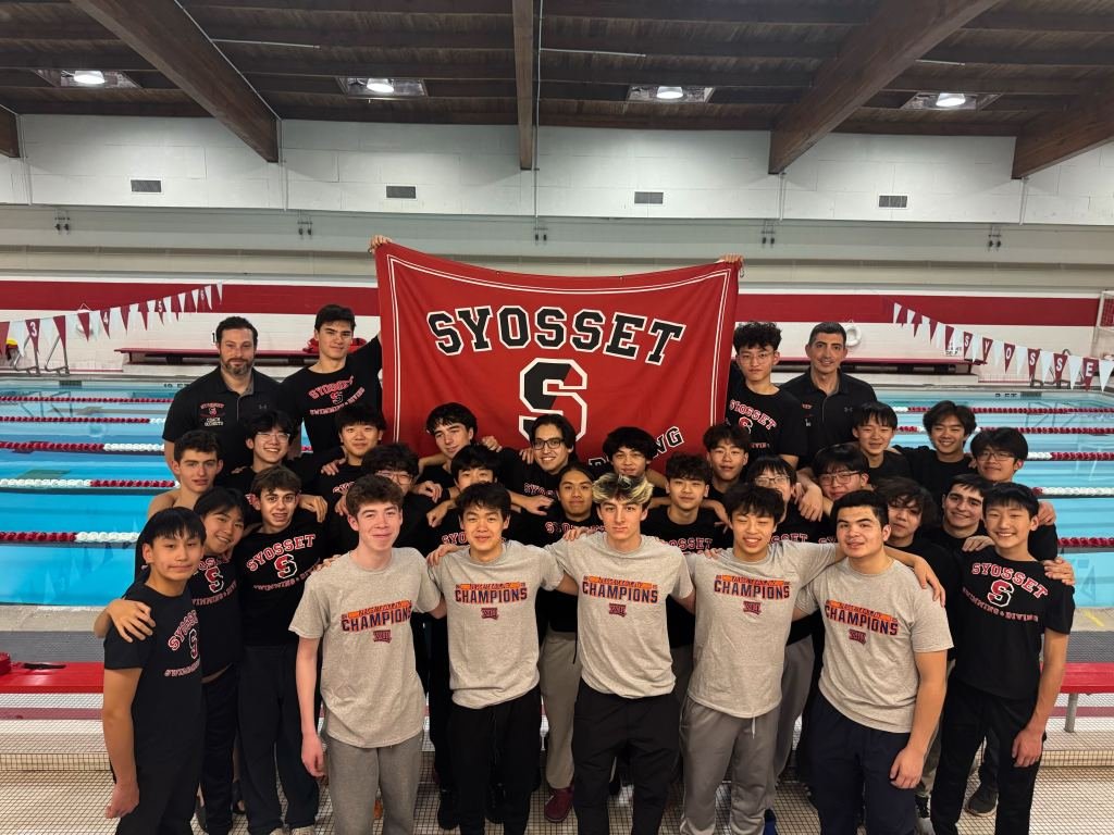 Syosset boys swim team with coaches and banner