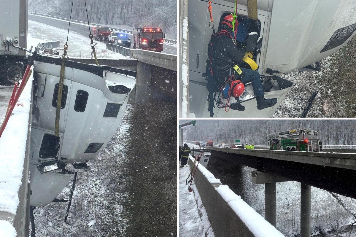 Truck driver rescued after dangling 100 feet in the air off West Virginia highway