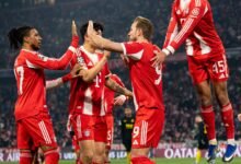 Kane's double sends Bayern through in Champions League