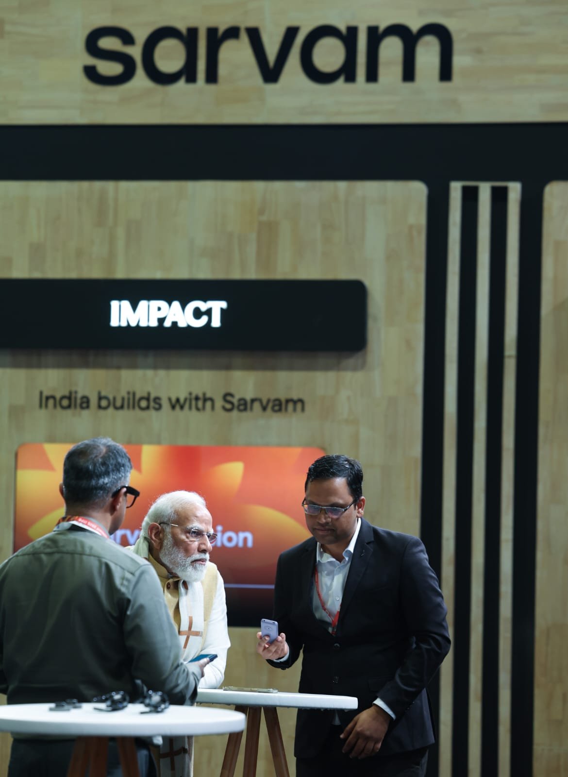 PM Modi views Sarvam AI demo on HMD feature phones at India AI Impact Summit 2026 2 PM Modi views Sarvam AI demo on HMD feature phones at India AI Impact Summit 2026